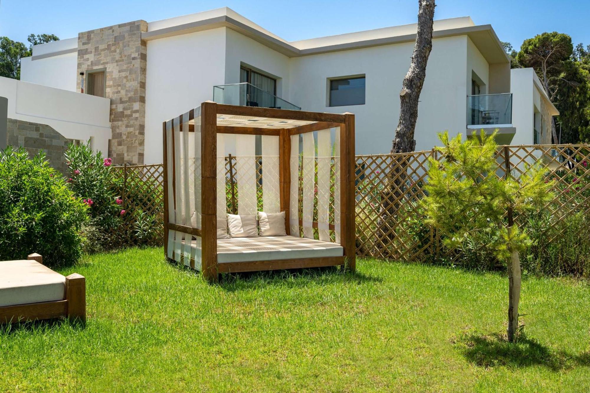 Radisson Blu Resort Al Hoceima Ngoại thất bức ảnh A pergola in a garden